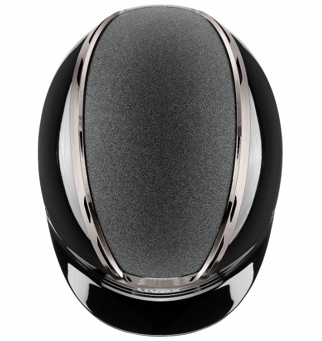 A close-up studio shot of a glossy black helmet with a textured dark gray central panel and polished silver metallic trim, isolated on a white background.