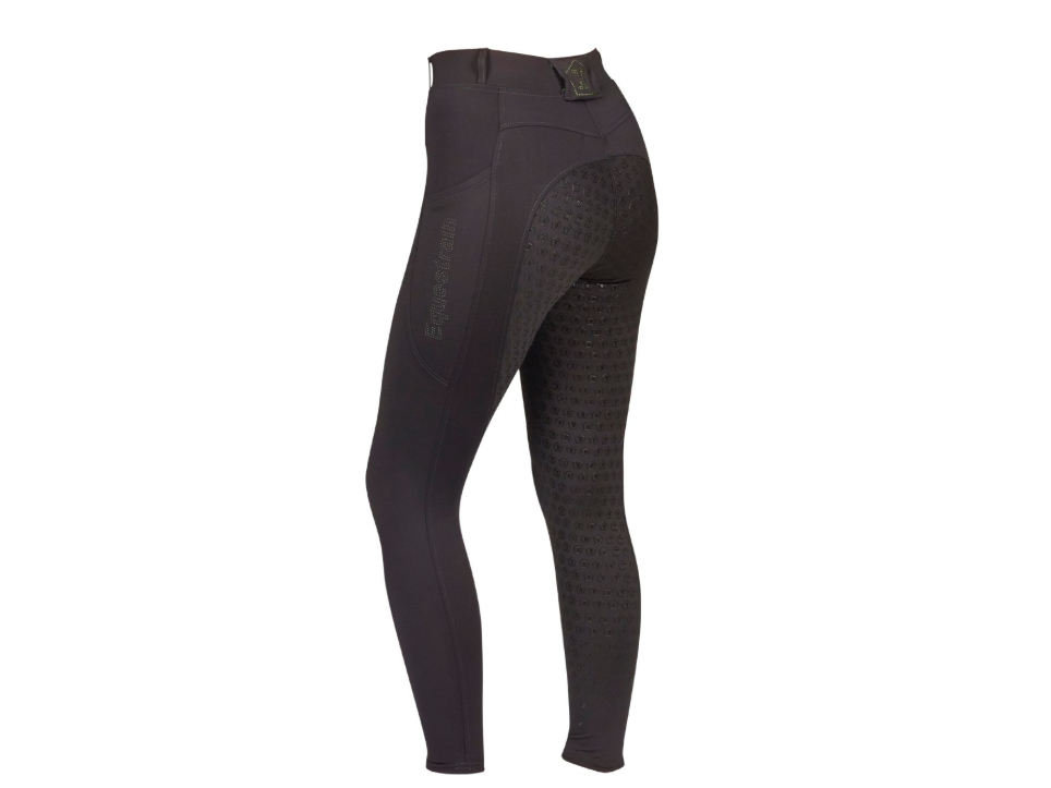 Black equestrian riding tights with textured grip panels on the thighs and a subtle vertical 'ExploreTeam' logo on the left leg, shown on a white background.